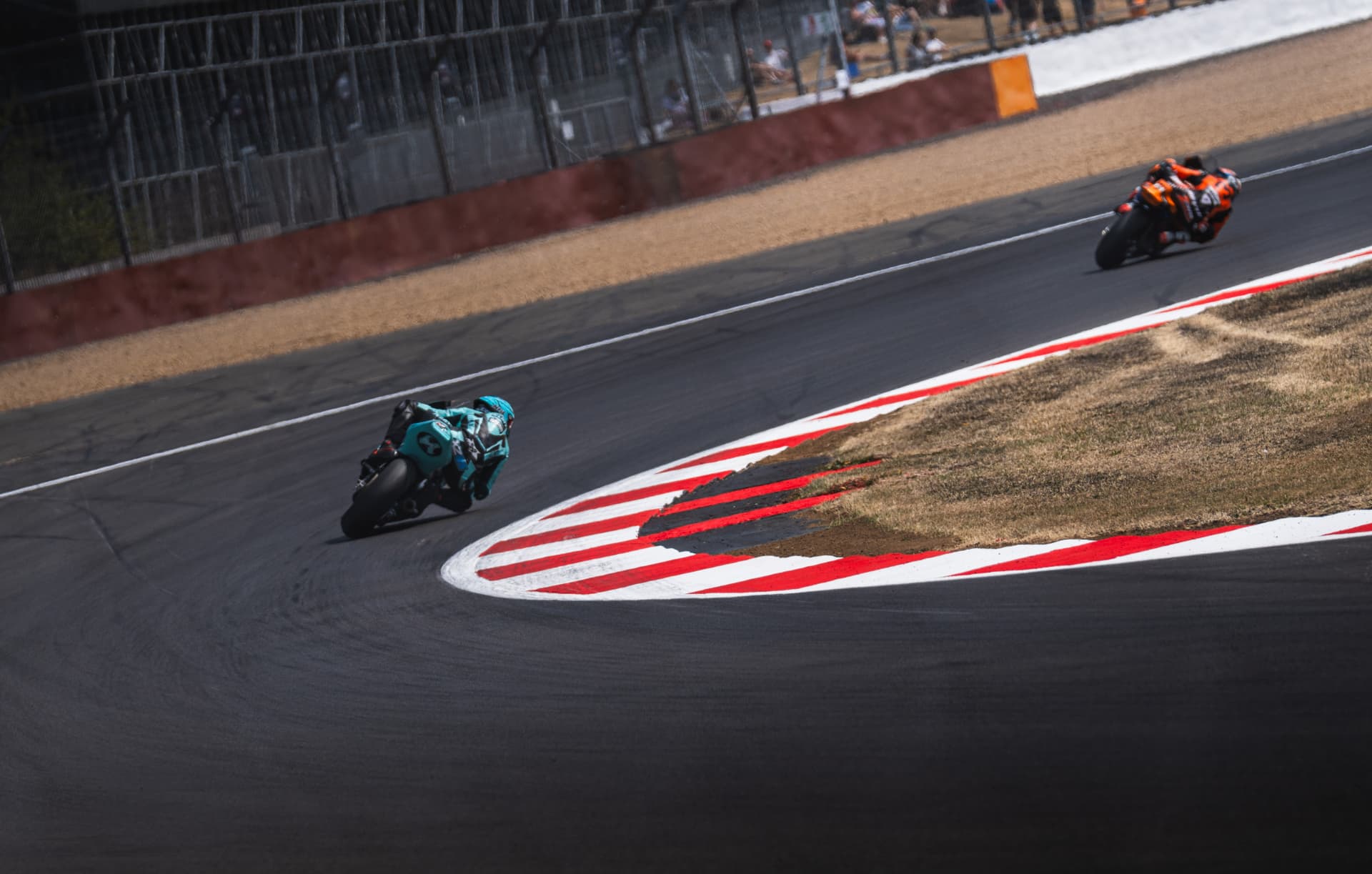Motorsport photography: rider carrying speed through a corner complex